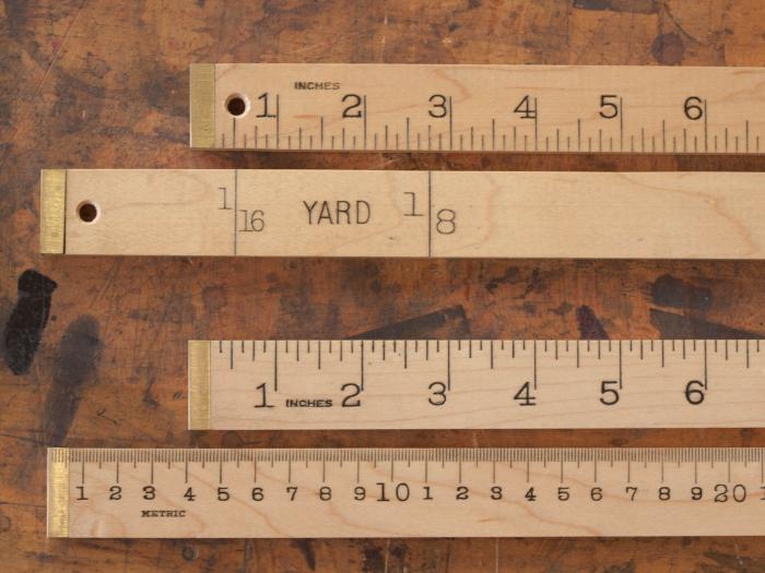Brass Bound Yard and Meter Sticks - Yard Stick (TOP) has Inches and 1/8ths of a yard. Meter Stick (BELOW) has MM and Inches.